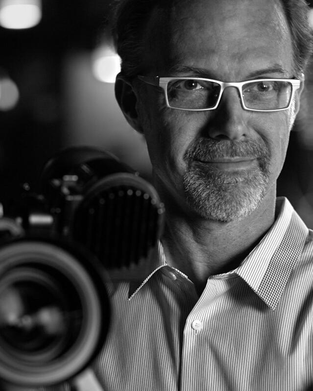 Cinematographer Scott L. Dale with ARRI camera Black & White photo of cinematographer Scott L. Dale with ARRI camera