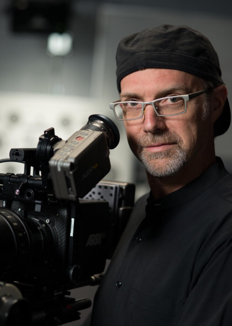 Cinematographer Scott L. Dale Black and white Photo of Cinematographer Scott L. Dale with his camera.