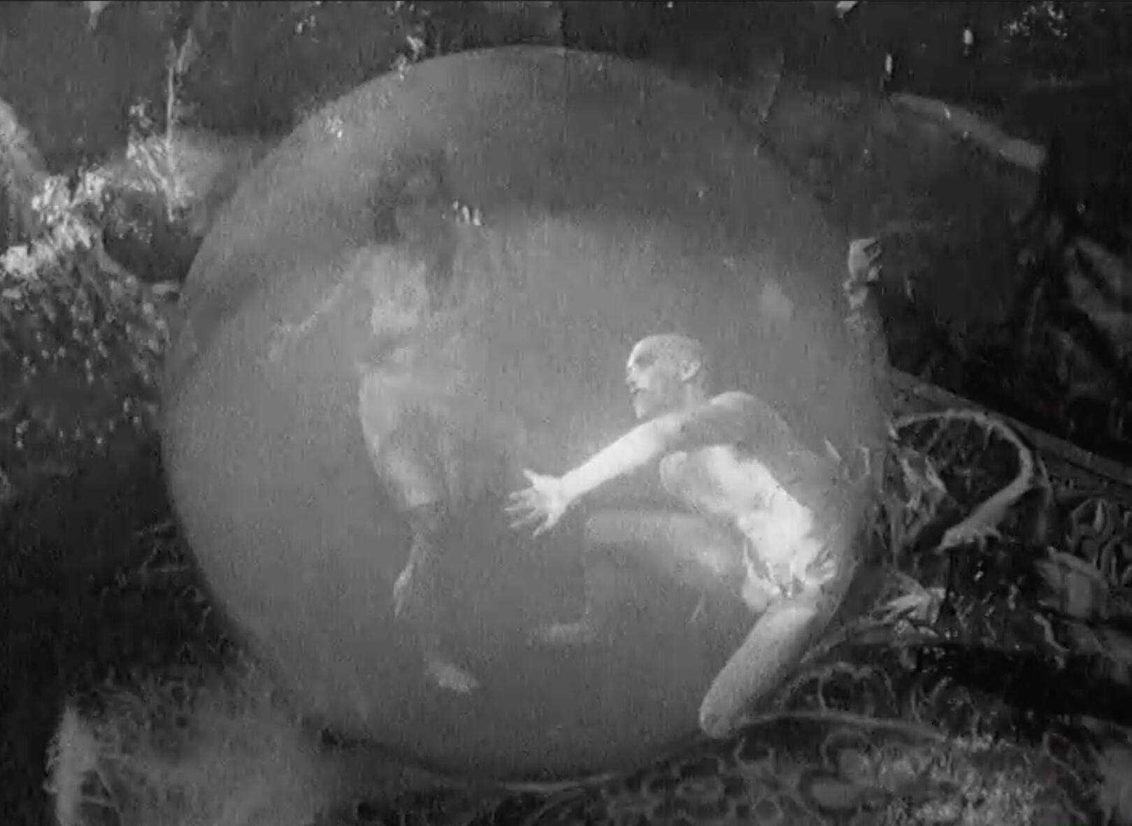 Ghostlike dancers in crystal ball image by Scott L. Dale Black & White image of ghostlike dancers in crystal ball, shot with hand crank camera from 1920's silent period film - image by Scott L. Dale